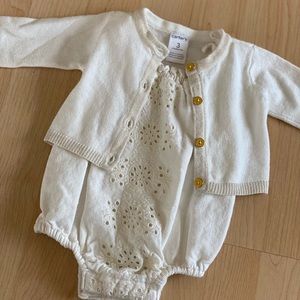 Adorable baby onesie with cardigan.